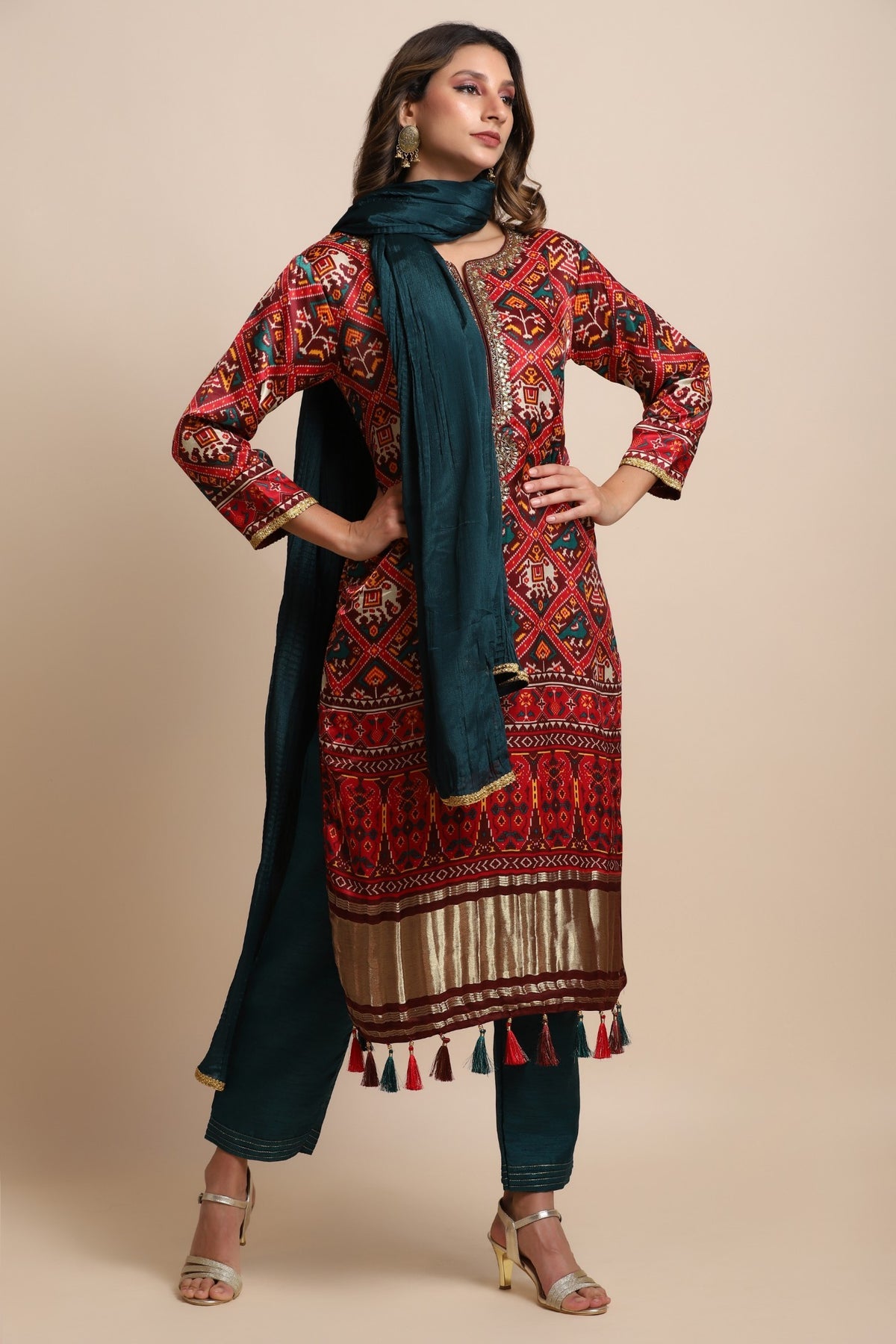 Red patola suit with embroidery on neckline paired with peacock blue pants and peacock blue dupatta