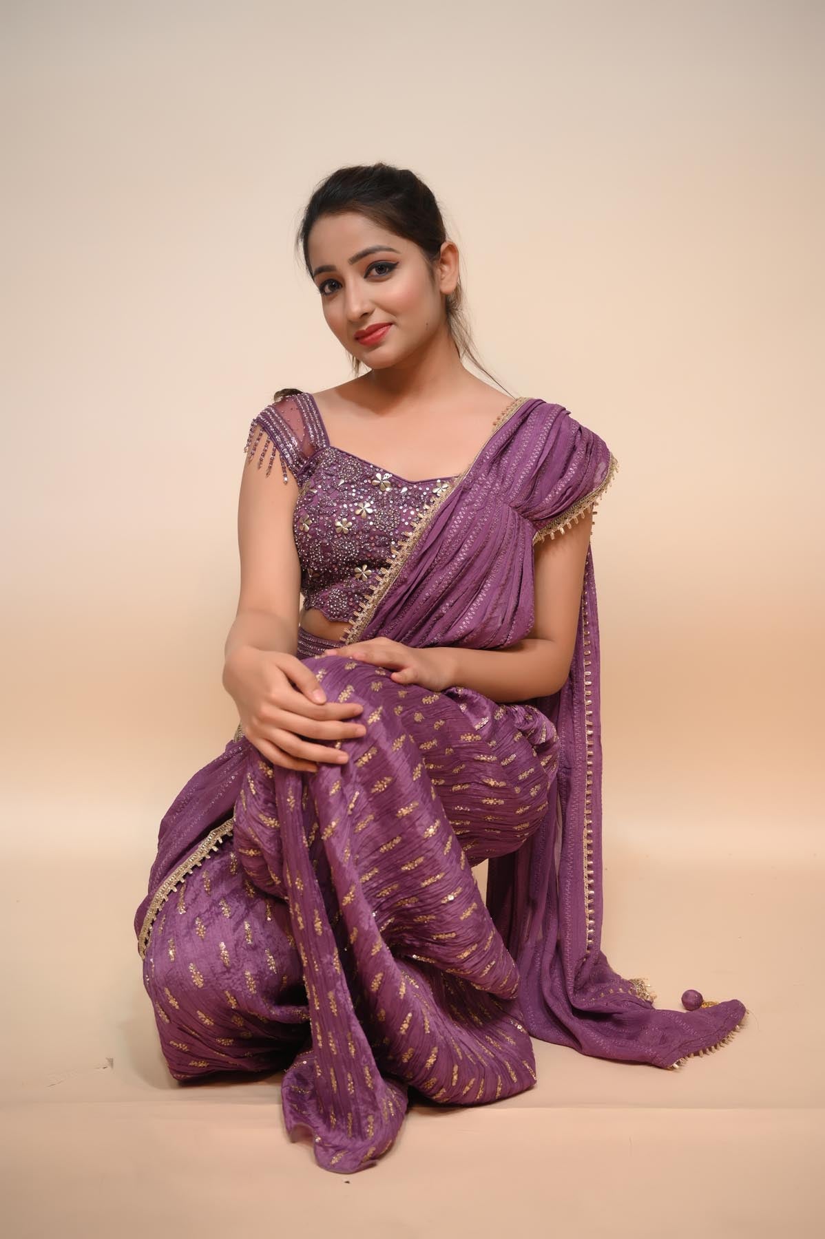 Elegant Purple Net Saree with Stone, Sequins, and Lace Embellishments