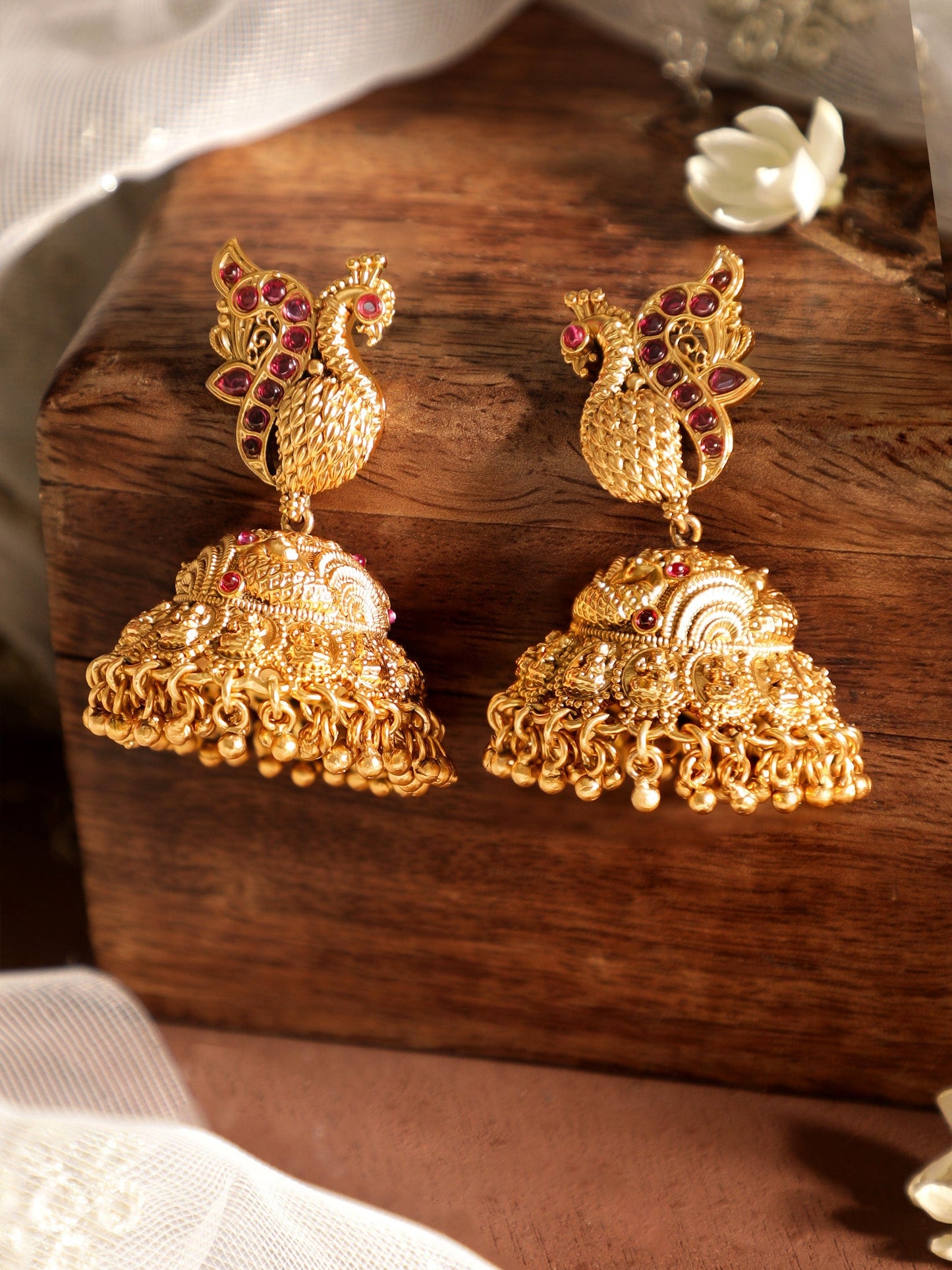 Celestial Plumage 22k Gold plated Jhumka Earrings with Peacock Charm